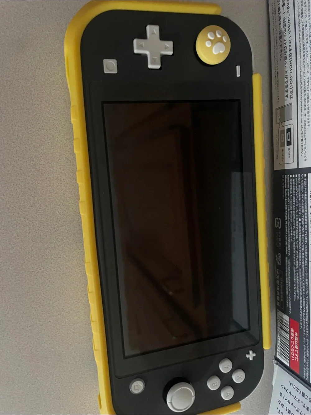Nintendo Switch Lite Gray with Yellow Case with game